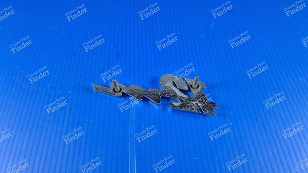 Sigle Heckabzeichen '12M'. - FORD Taunus 12M (P6) - 2