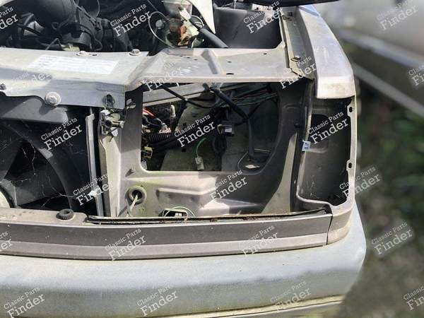 Support de phare / Face avant gauche - PEUGEOT 309 - 7113.57- 0