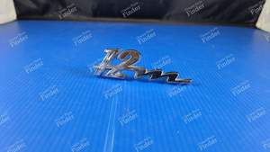 Sigle Heckabzeichen '12M'. - FORD Taunus 12M (P6) - thumb-1